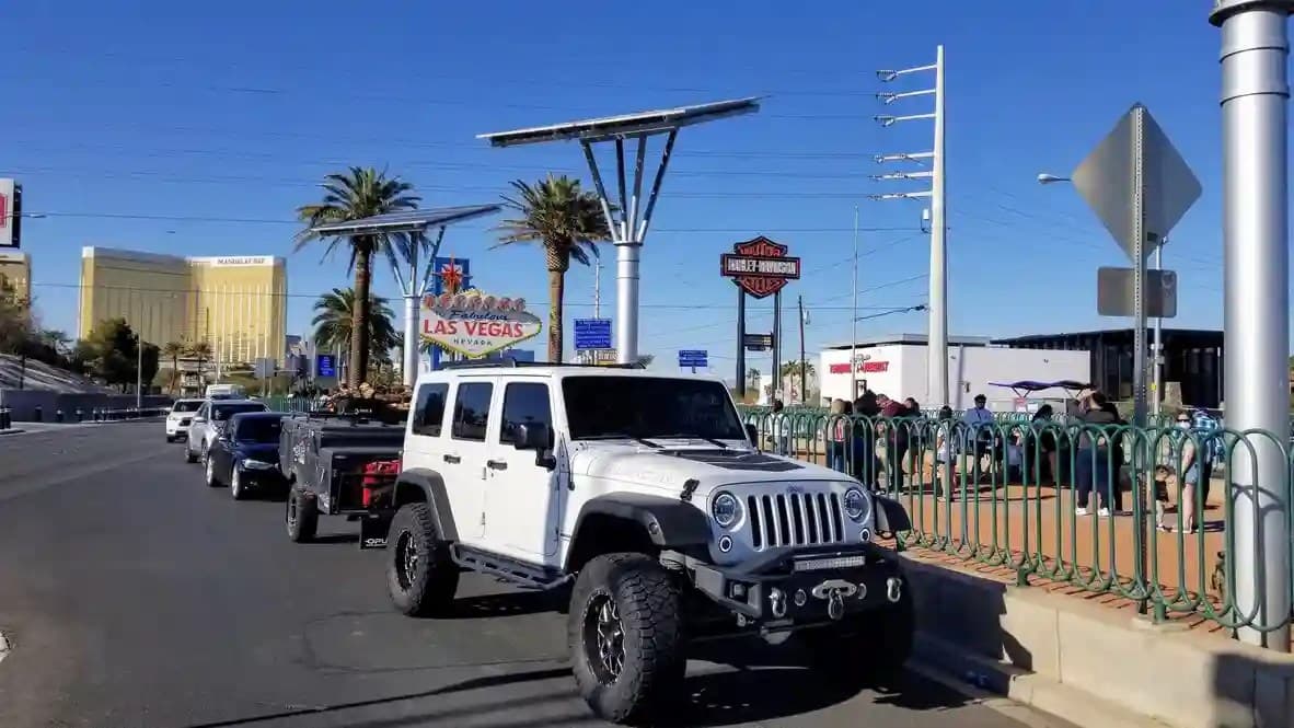 An OPUS camper towed past the Welcome to Las Vegas sign, Nevada