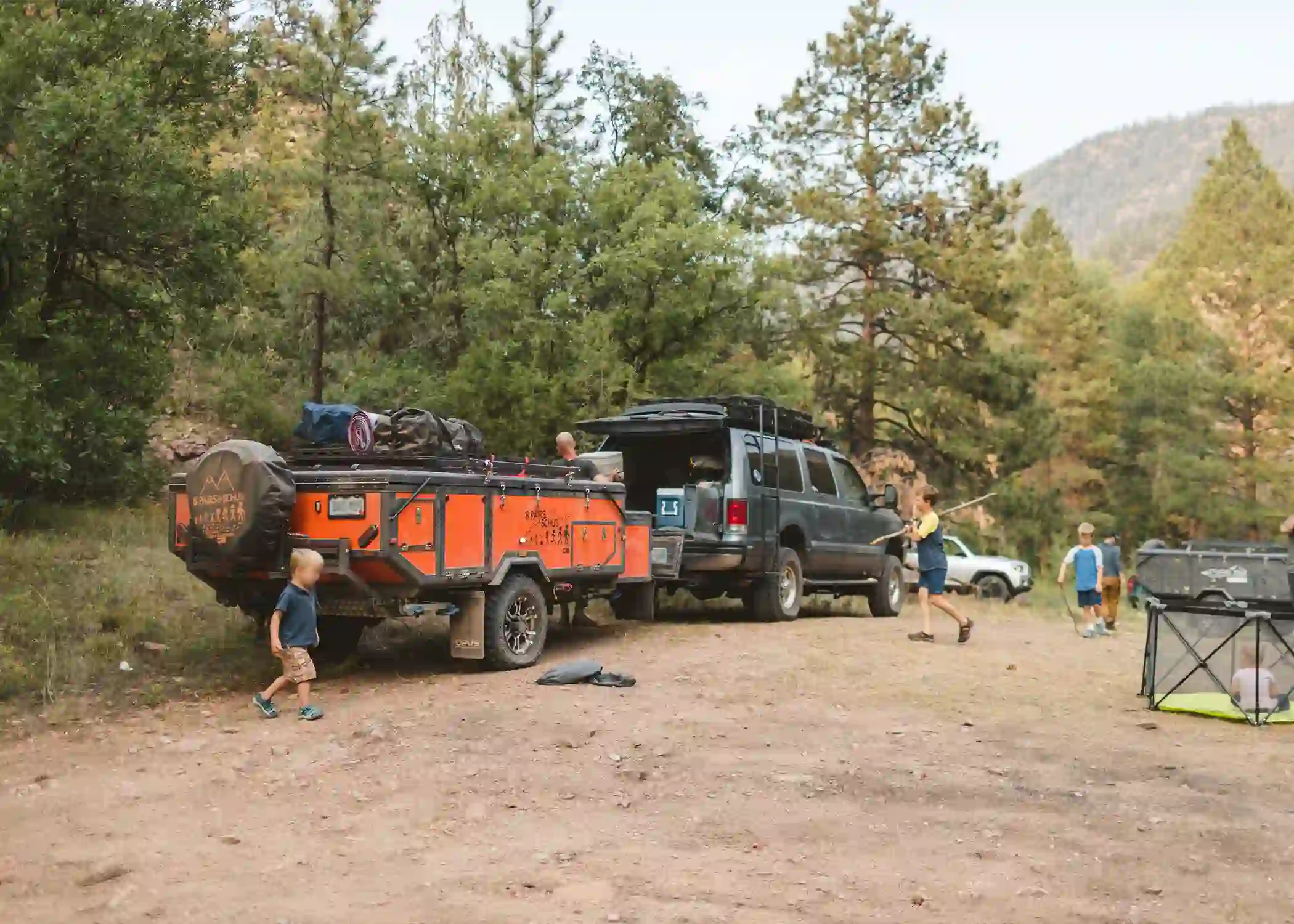 Children playing at an Adventure Run campsite beside an OP4