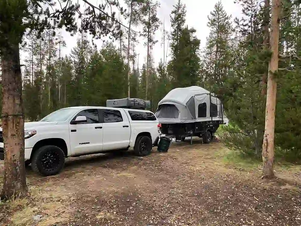 Toyota Tundra and OP4 parked under the trees