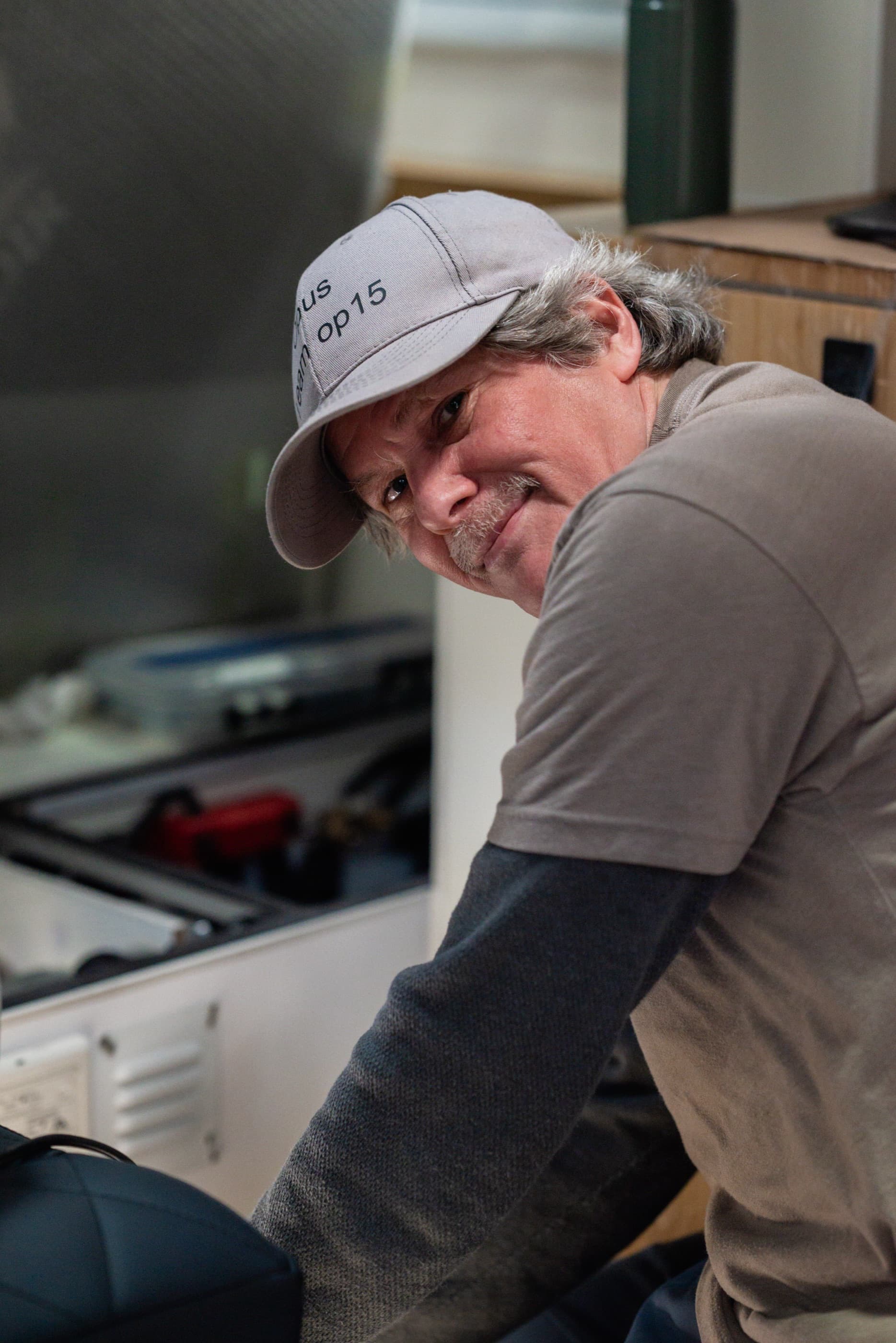 An OPUS technician at the workbench in the Antioch workshop