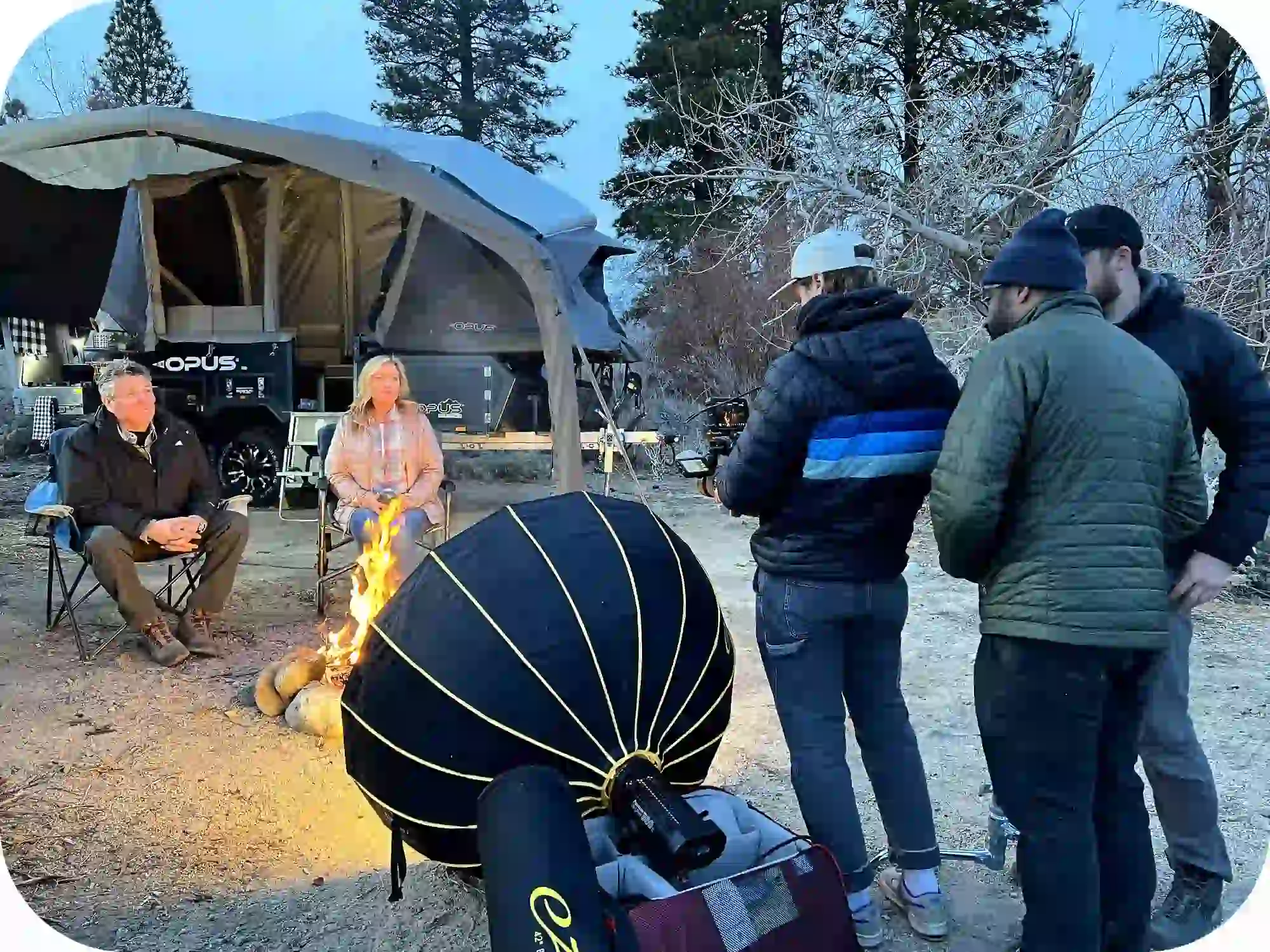 OPUS camper setup process with group preparing outdoor camping gear